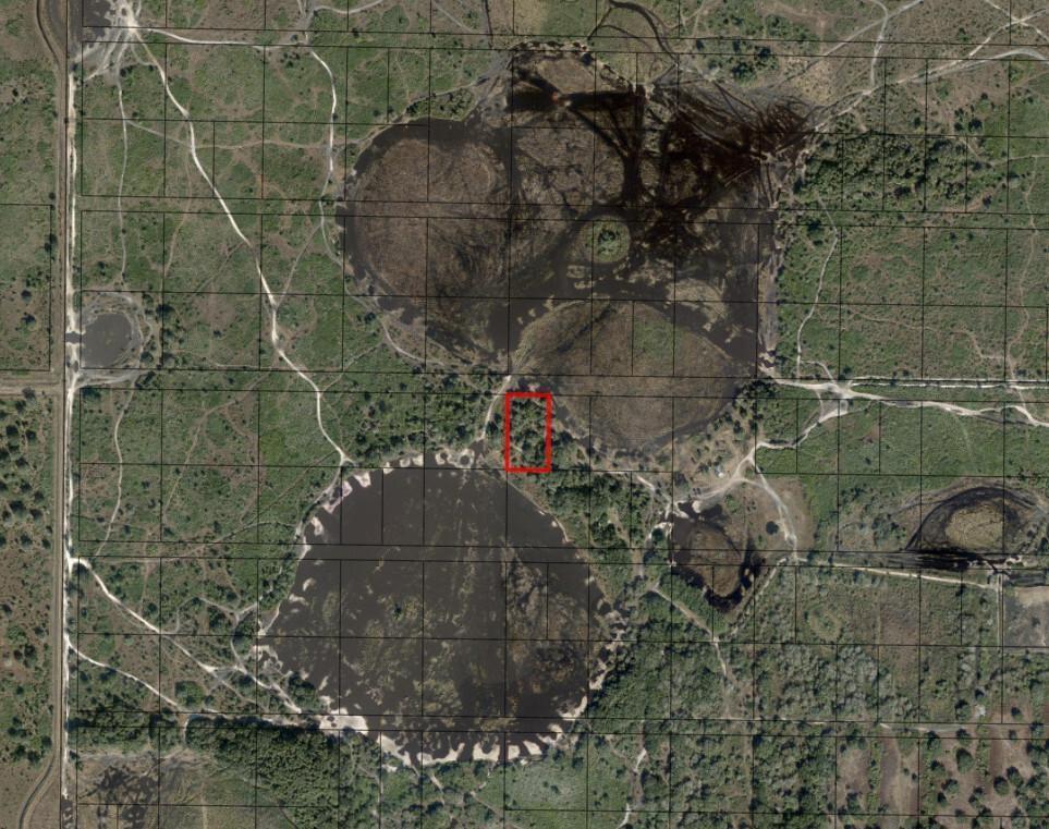 This is an aerial map showing a rectangular property parcel highlighted in red near wetlands — 0 NW 304th Street, Okeechobee FL 34972, OKEECHOBEE, FL