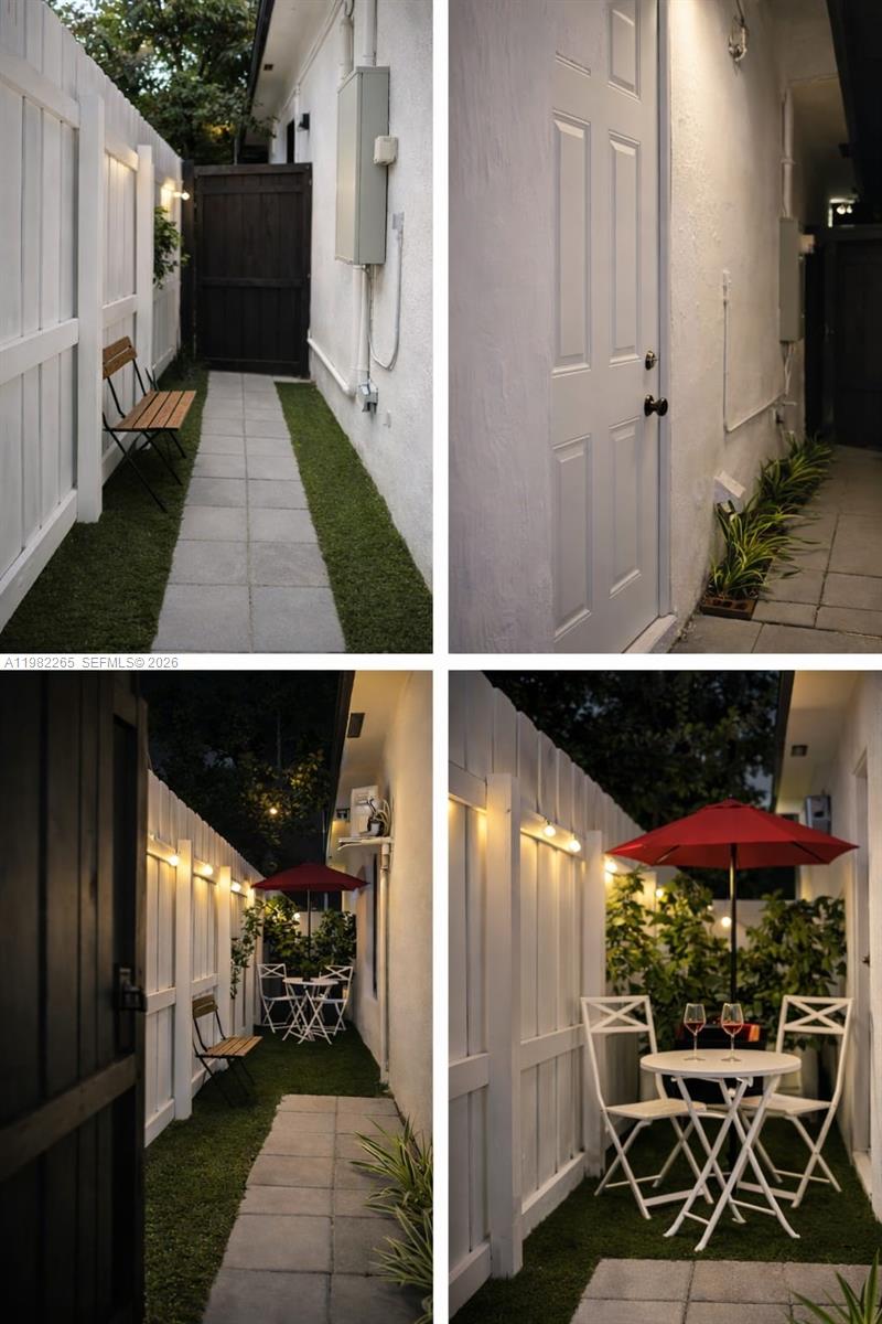 A narrow outdoor side yard features a paved walkway, artificial grass, and a small bistro set — 613 NW 10th St # 2, Hallandale Beach FL 33009, HALLANDALE BEACH, FL