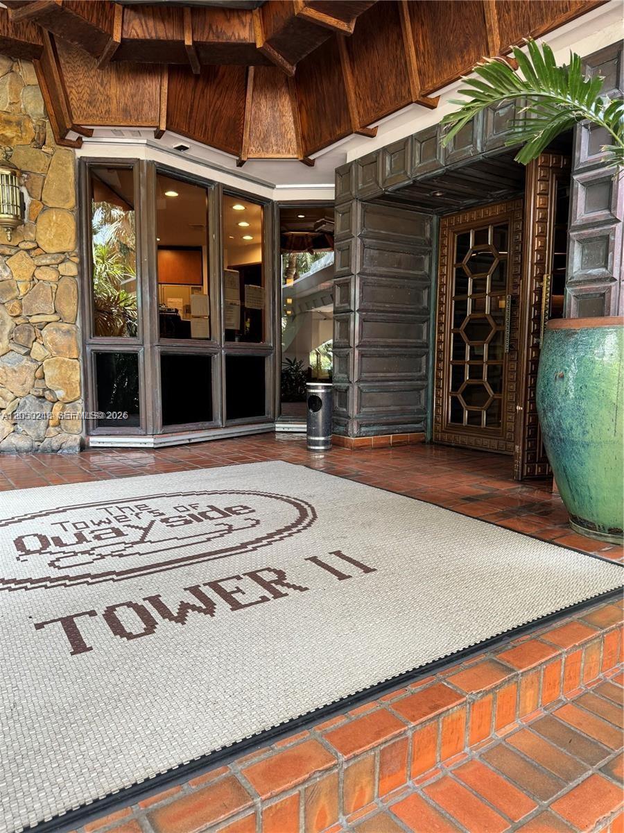 The entrance to Tower II at The Quayside features a tiled porch and decorative door — 2000 Towerside Ter # 905, Miami FL 33138, MIAMI, FL