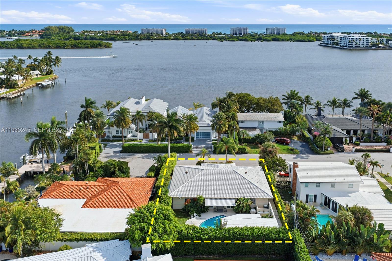 An aerial view shows a residential property with a pool outlined in yellow — 2607 Holy Cross Ln, Lake Worth FL 33460, LAKE WORTH, FL