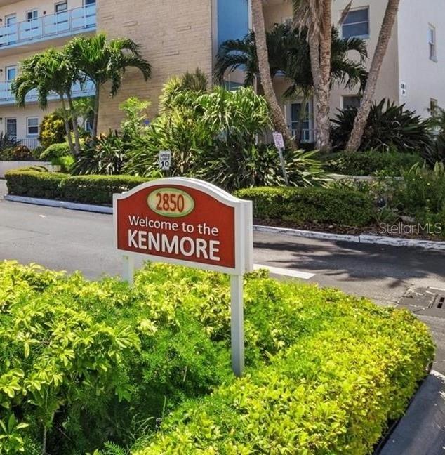 A sign for The Kenmore stands in front of a multi-story building and landscaping — 2850 59TH STREET S UNIT 205, GULFPORT, FL