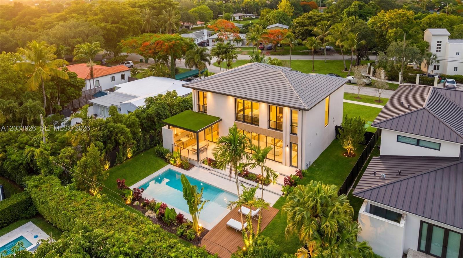 An aerial view shows a two-story house with a swimming pool and landscaped backyard — 5854 SW 30th St, Miami FL 33155, MIAMI, FL