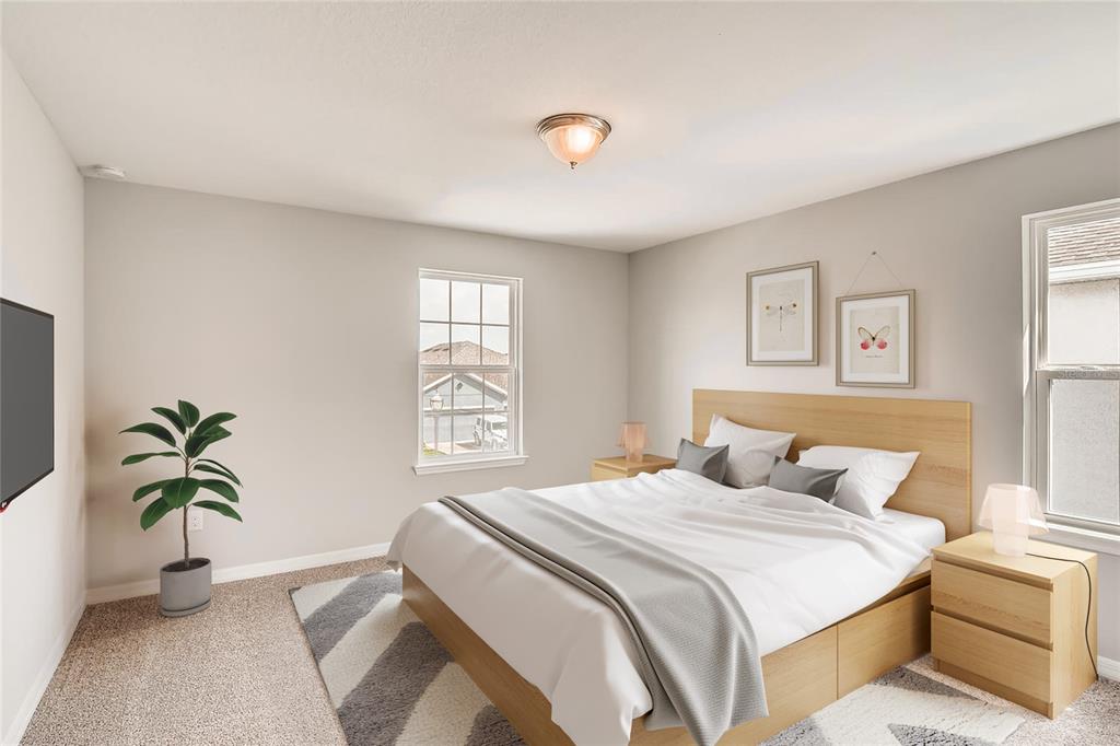 A bedroom features a light wood bed frame, two nightstands, and a patterned area rug — 5171 MOCKINGBIRD SOUND COURT, SANFORD, FL