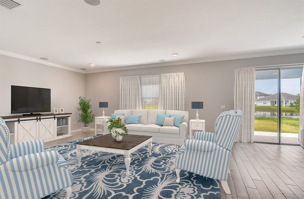 This is a digital rendering of a living room with a blue patterned rug — 5171 MOCKINGBIRD SOUND COURT, SANFORD, FL