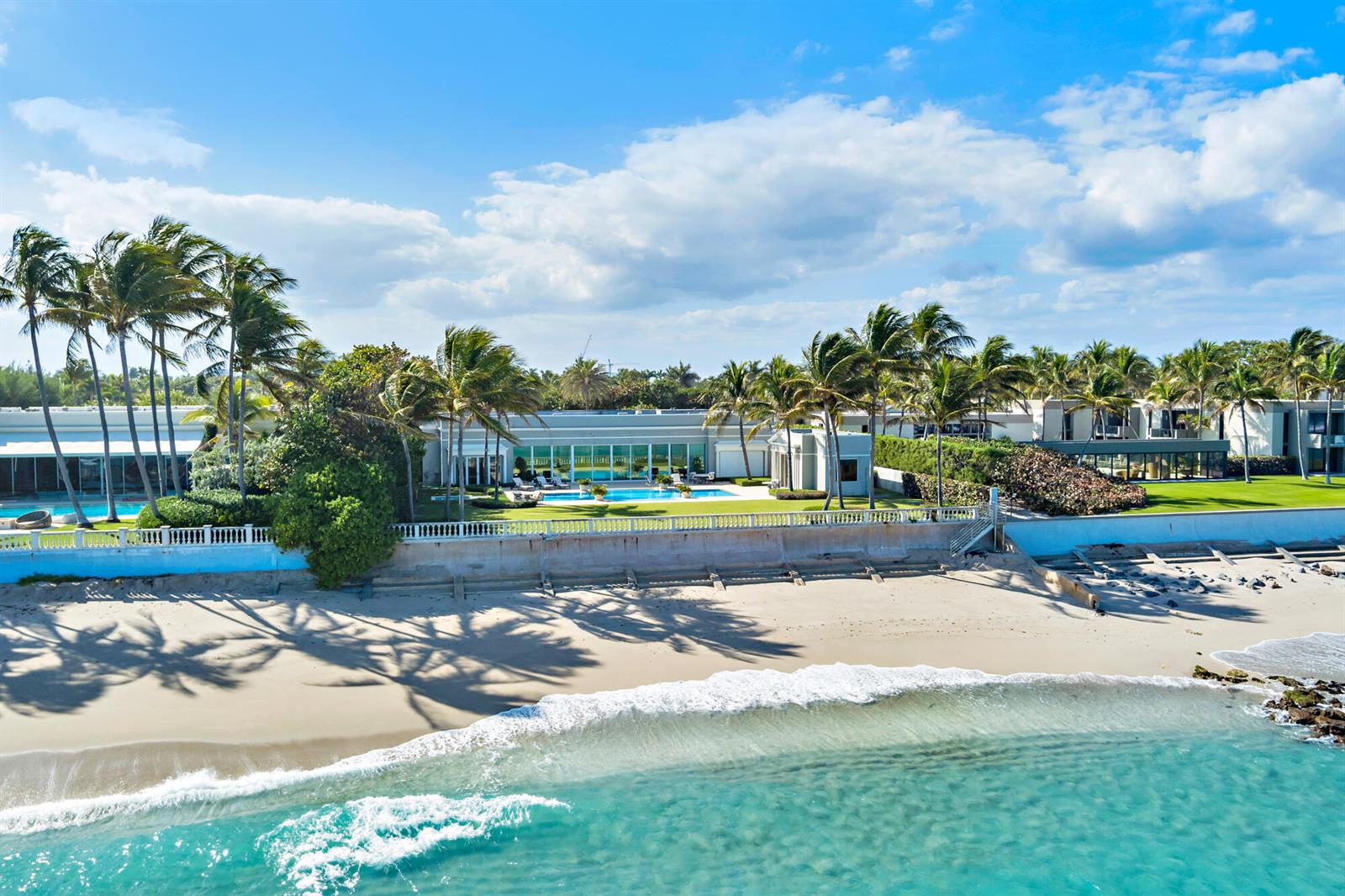 An aerial view shows a beachfront estate with a swimming pool and palm trees — 5 Via Los Incas, Palm Beach FL 33480, PALM BEACH, FL