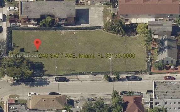 This aerial view shows a vacant, fenced-in rectangular lot in a residential neighborhood — 240 SW 7TH AVE, Miami FL 33130, MIAMI, FL