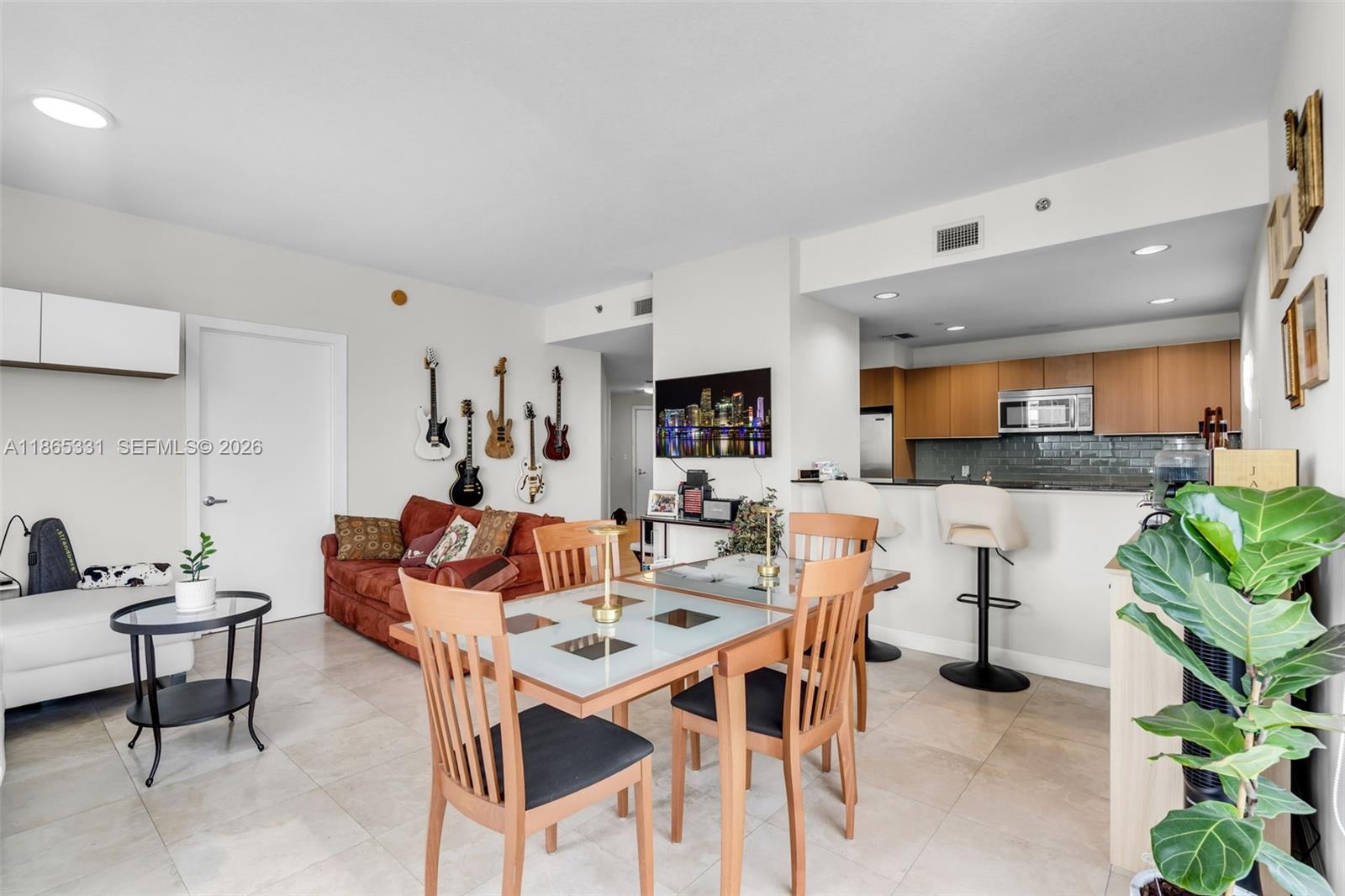 A bathroom features a white bathtub, a double vanity, and gray stone tile flooring — 1060 Brickell Ave # 3601, Miami FL 33131, MIAMI, FL