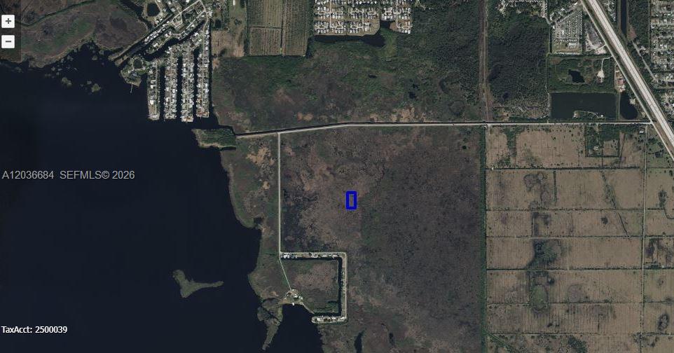 An aerial map view shows a rectangular property highlighted in blue amidst undeveloped land — 0 UNKNOWN, Cocoa FL 32926, COCOA, FL