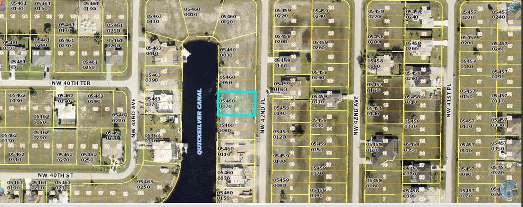 This is an aerial map showing a vacant residential lot highlighted in blue near a canal — 4008 NW 42ND PLACE, CAPE CORAL, FL