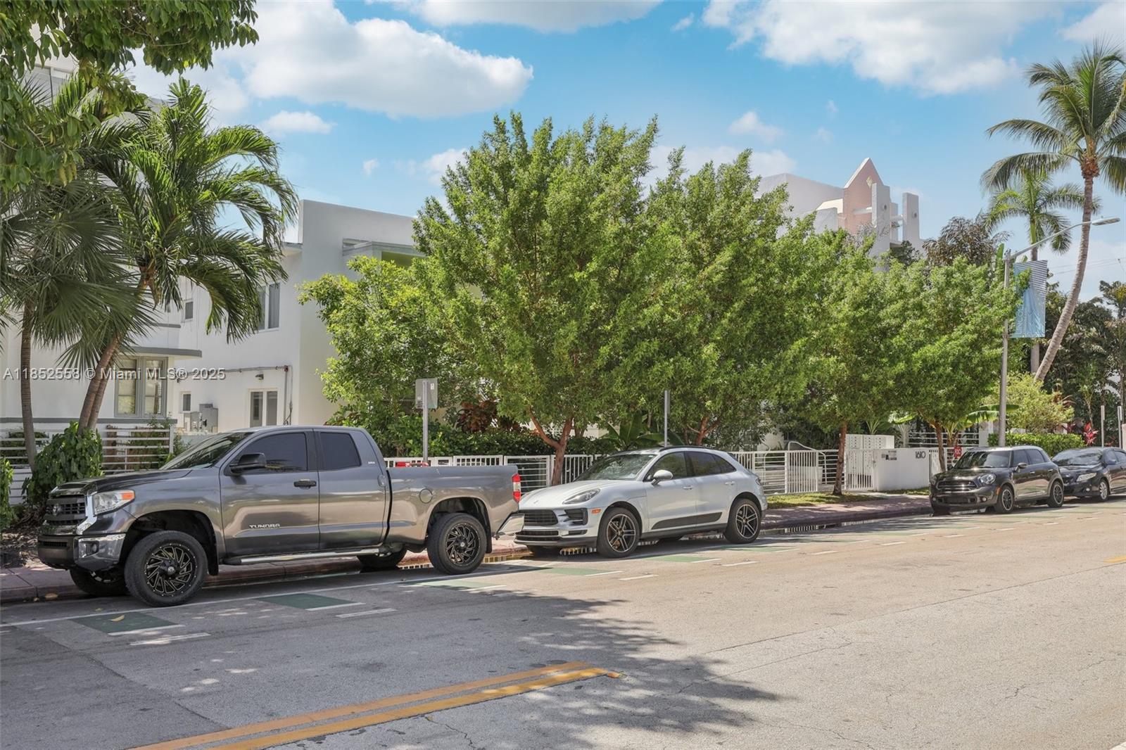 A street view shows a gray pickup truck and several cars parked along a tree-lined road — 1610 Euclid Ave # B101, Miami Beach FL 33139, MIAMI BEACH, FL