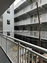 A view from a balcony looking across to the exterior walkways of an apartment building — 215 SE 3rd Ave # 107A, Hallandale Beach FL 33009, HALLANDALE BEACH, FL