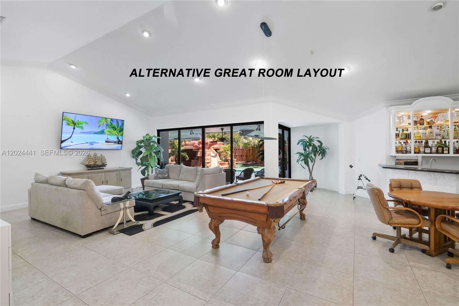 A spacious great room features a pool table, a living area, and a built-in bar — 2900 NW 25th Way, Boca Raton FL 33434, BOCA RATON, FL