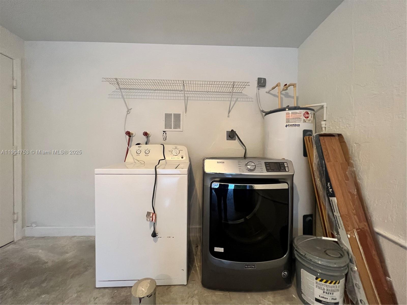 A laundry area features a white washing machine, a gray dryer, and a water heater — 8564 SW 214th Way, Cutler Bay FL 33189, CUTLER BAY, FL