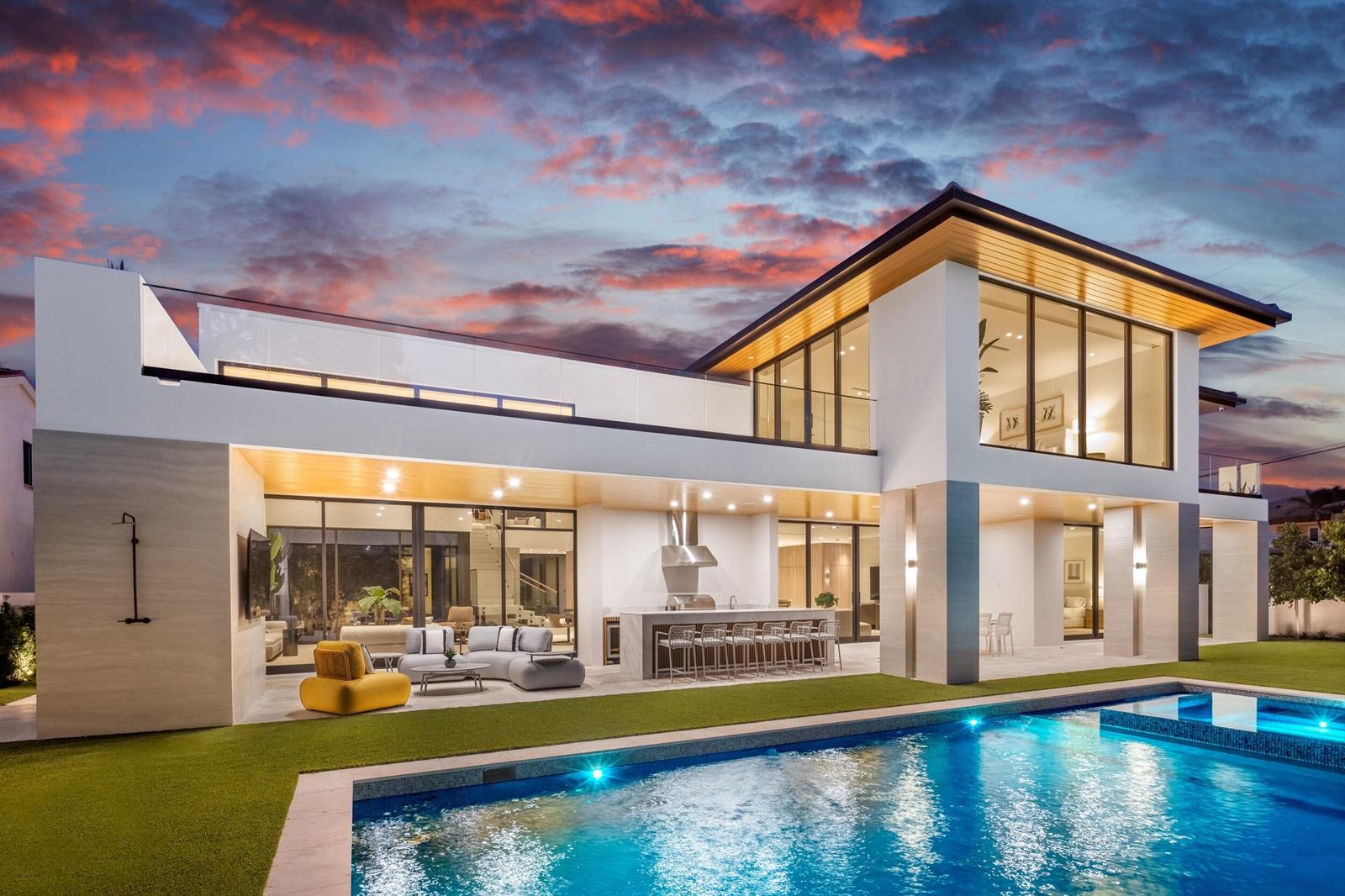 A modern two-story house with a pool, outdoor kitchen, and patio at sunset — 1351 Cocoanut Road, Boca Raton FL 33432, BOCA RATON, FL
