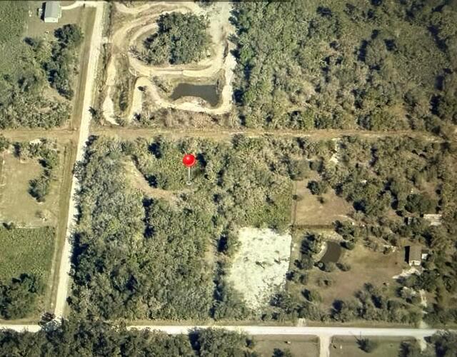 An aerial view shows a wooded, undeveloped rectangular lot marked with a red pin — 18178 NW 258th Street, Okeechobee FL 34972, OKEECHOBEE, FL