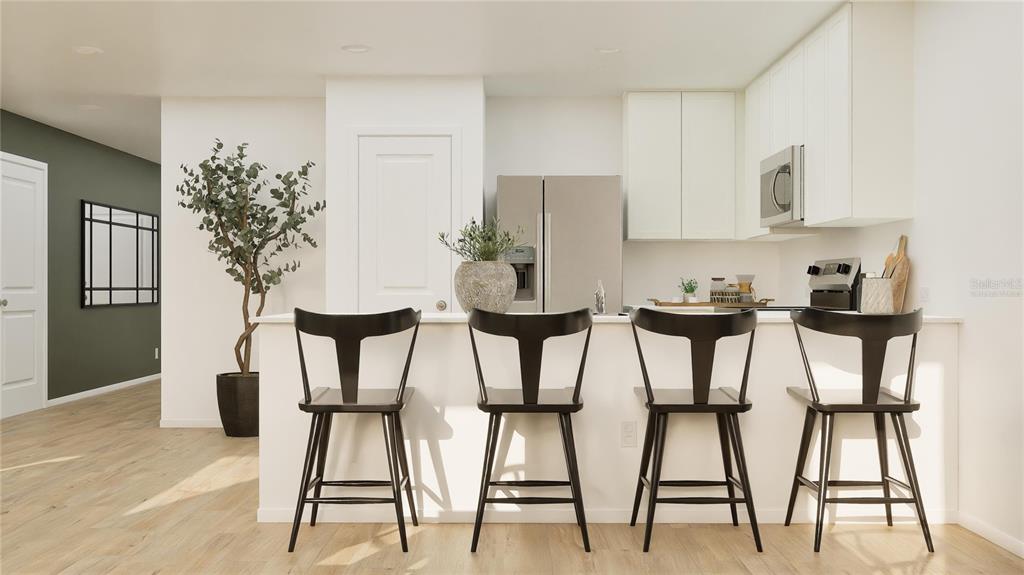 This is a digital rendering of a modern kitchen featuring a breakfast bar with four stools — 3881 AMERS LOOP, HAINES CITY, FL
