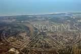 An aerial view shows a large residential development with curved roads and surrounding green space — 7 LAUREL COURT, PLACIDA, FL