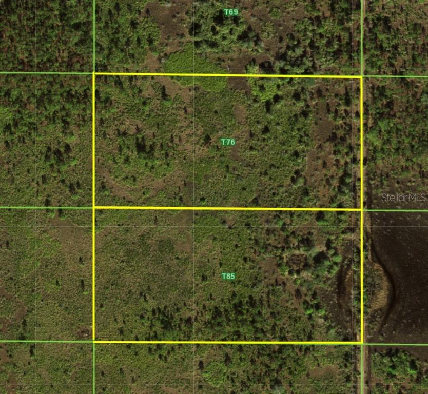 This aerial map shows two adjacent rectangular parcels of undeveloped land marked T76 and T85 — 50530 BERMONT ROAD, PUNTA GORDA, FL