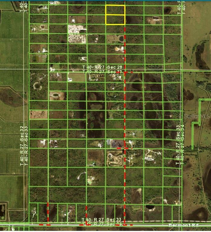 This is an aerial map showing a grid of land parcels with two lots highlighted yellow — 50530 BERMONT ROAD, PUNTA GORDA, FL
