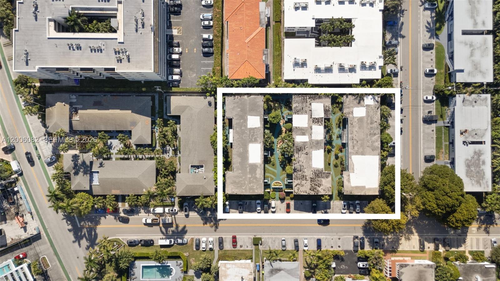This aerial view shows a multi-unit residential complex with flat roofs and a central courtyard — 1060 98 St, Bay Harbor Islands FL 33154, BAY HARBOR ISLANDS, FL