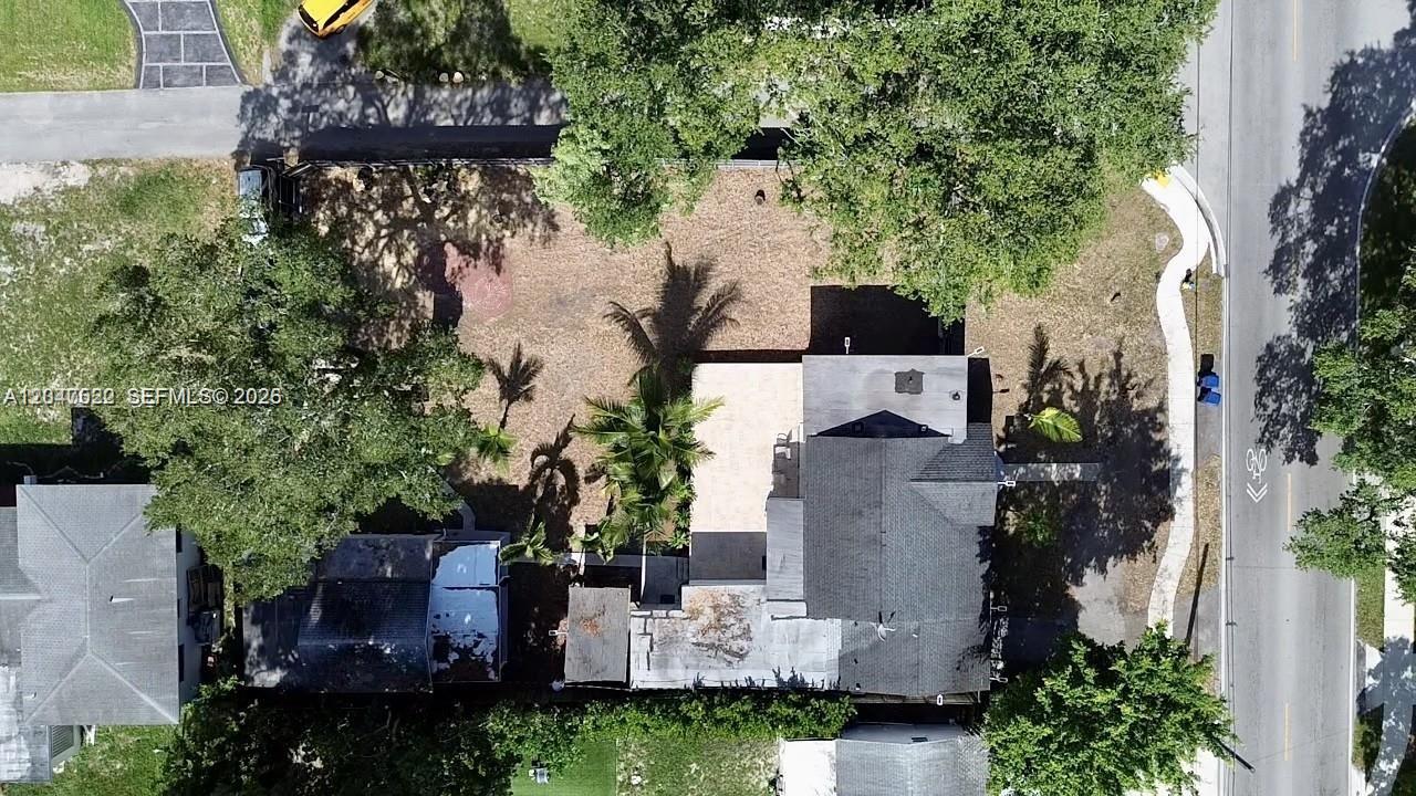 An aerial view shows a residential property with a house, a large yard, and trees — 947 NE 149th st # 0, Miami FL 33161, MIAMI, FL