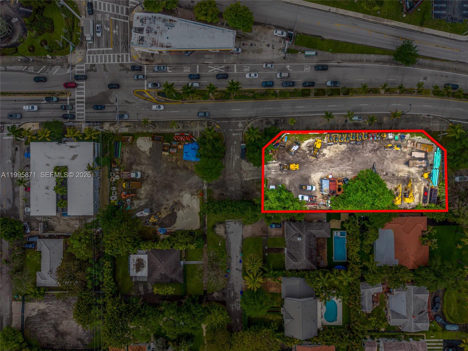 This aerial view shows a construction equipment storage lot outlined in red next to residential homes — 5445 & 5501 Biscayne Blvd, Miami FL 33137, MIAMI, FL