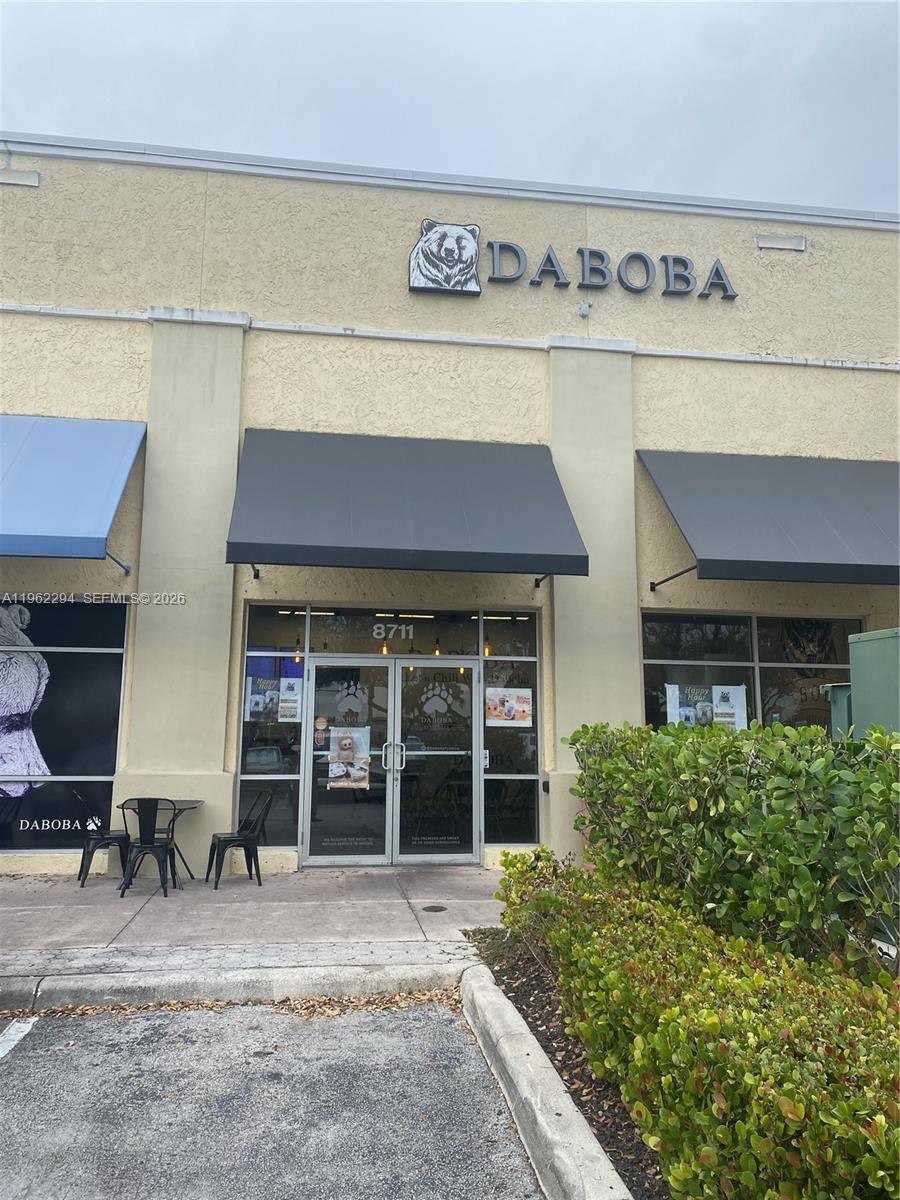 The exterior of a Daboba bubble tea shop features a beige facade with dark awnings — 8711 SW 124th Ave, Miami FL 33183, MIAMI, FL