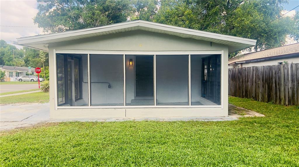 A kitchen features white cabinets, stainless steel appliances, and light-colored countertops — 5301 40TH STREET N, ST PETERSBURG, FL