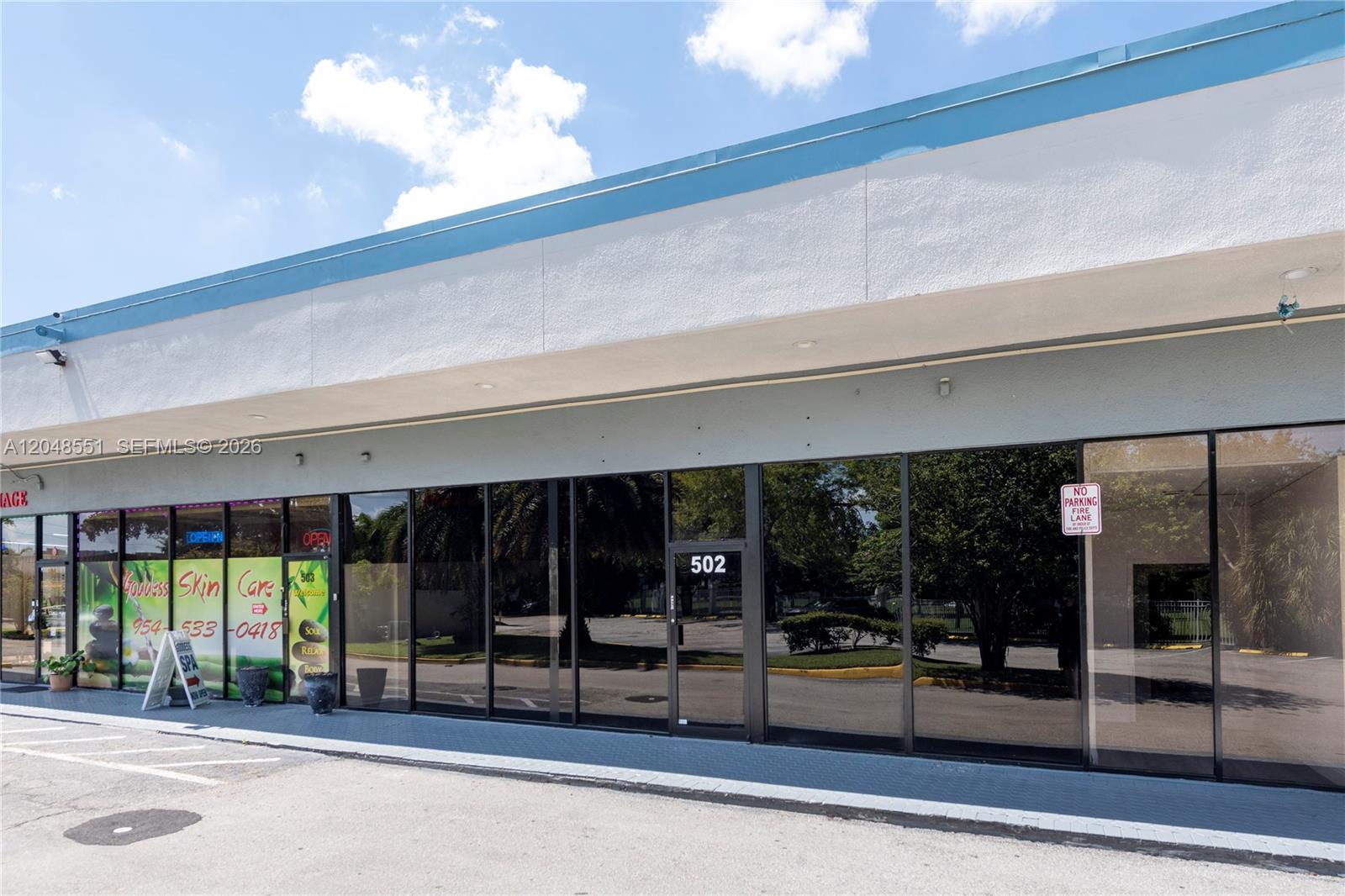 The exterior of a commercial building features a glass storefront with the number 502 displayed — 3801 N University Dr # 502, Sunrise FL 33351, SUNRISE, FL