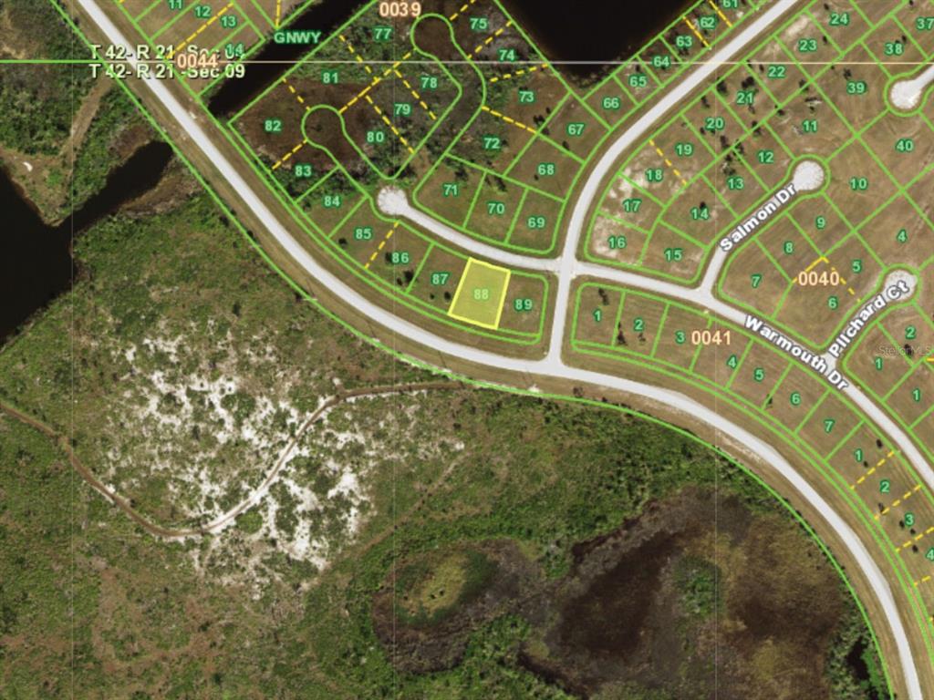 This is a satellite map showing a highlighted residential lot in a suburban neighborhood — 14145 WARMOUTH DRIVE, PLACIDA, FL