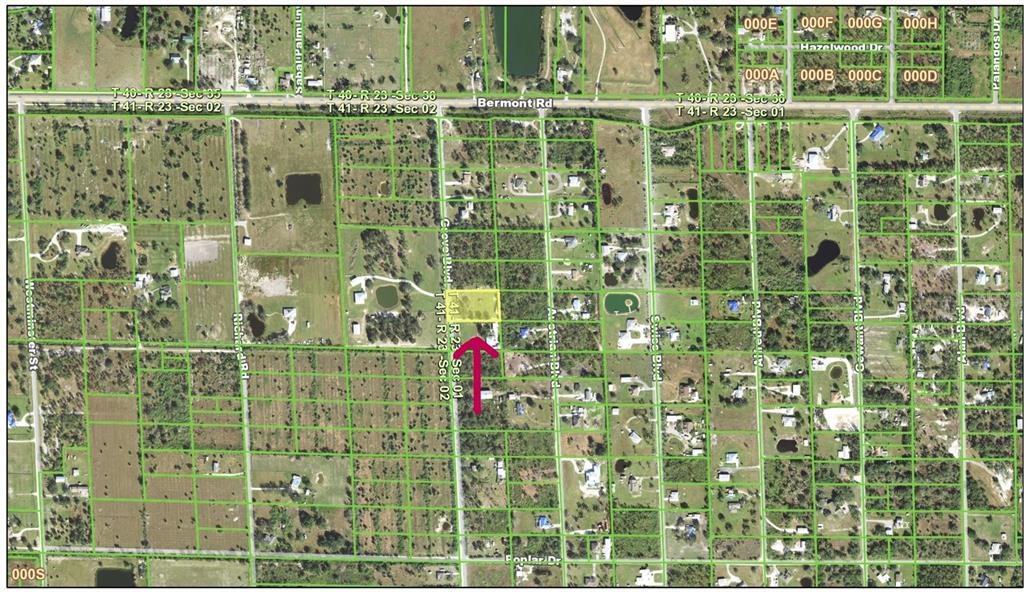 This is a satellite map showing a highlighted rectangular property lot and surrounding residential streets — 6104 GROVE BOULEVARD, PUNTA GORDA, FL