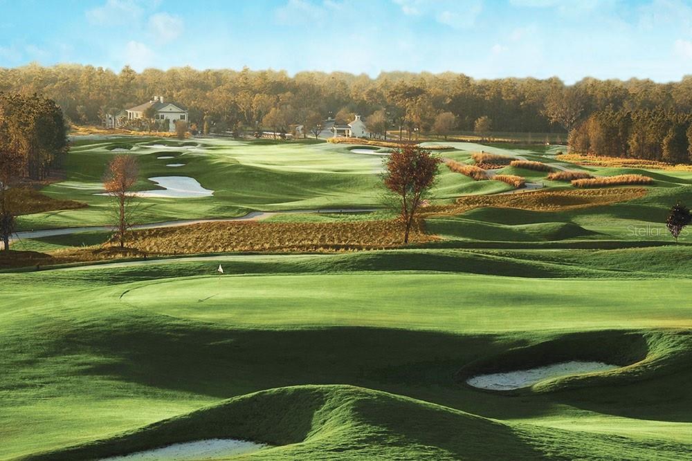 A view of a sprawling golf course with rolling green fairways and sand bunkers — 19987 ENGLISH WALNUT PLACE, BROOKSVILLE, FL