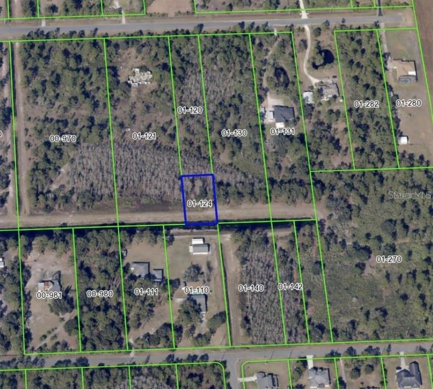 This is an aerial map showing a highlighted rectangular land parcel surrounded by wooded lots — 0 QUARTERLY PARKWAY, ORLANDO, FL