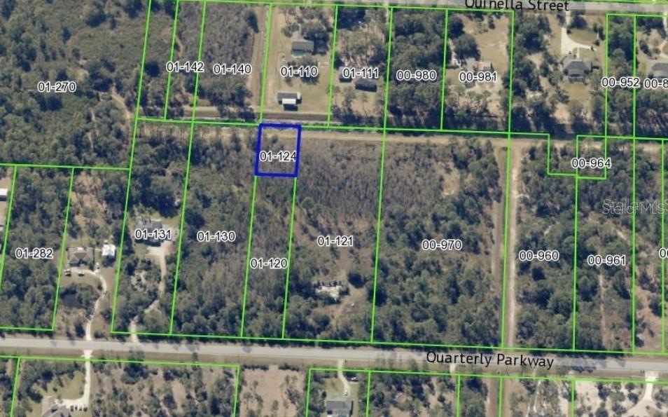 This is an aerial map showing a highlighted rectangular land parcel among surrounding wooded lots — 0 QUARTERLY PARKWAY, ORLANDO, FL