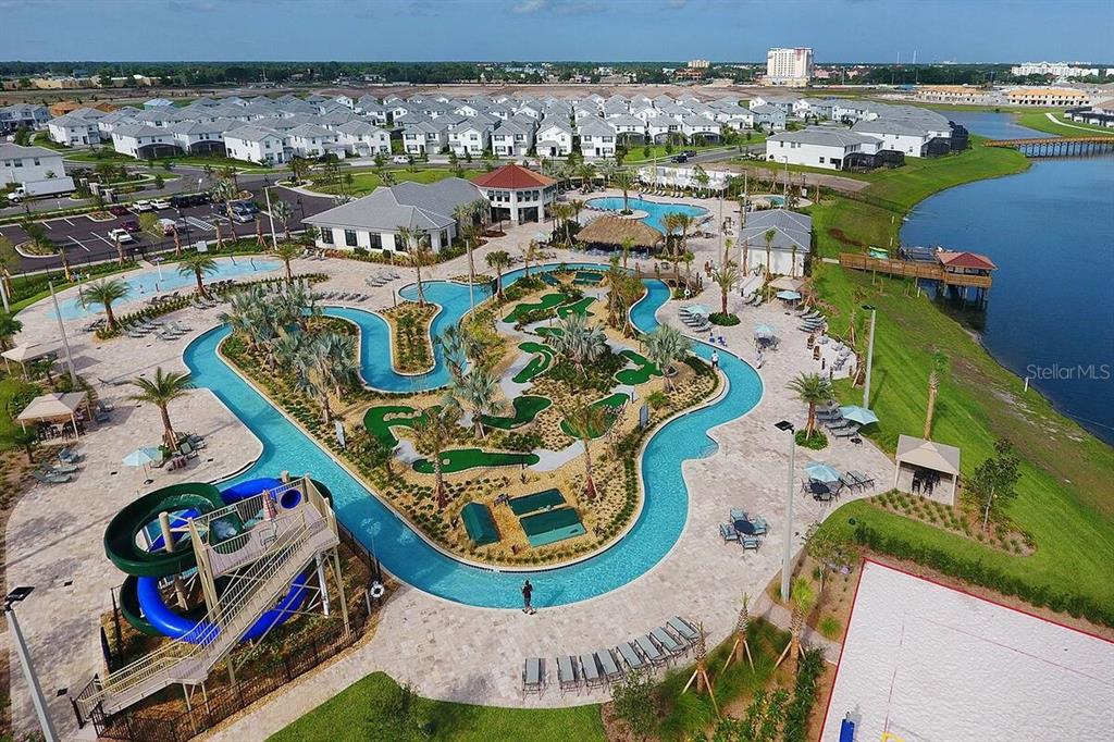 An aerial view of a resort-style pool complex with a lazy river and water slide — 2850 BOOKMARK DRIVE, KISSIMMEE, FL
