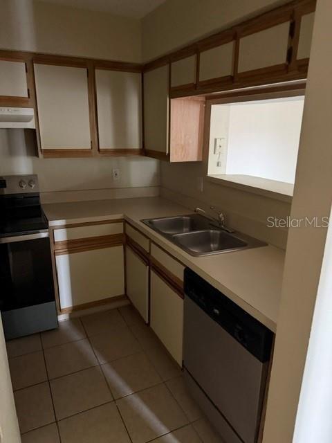 A kitchen features light-colored cabinets, a stainless steel dishwasher, and a black stove — 208 AFTON SQUARE UNIT 208, ALTAMONTE SPRINGS, FL