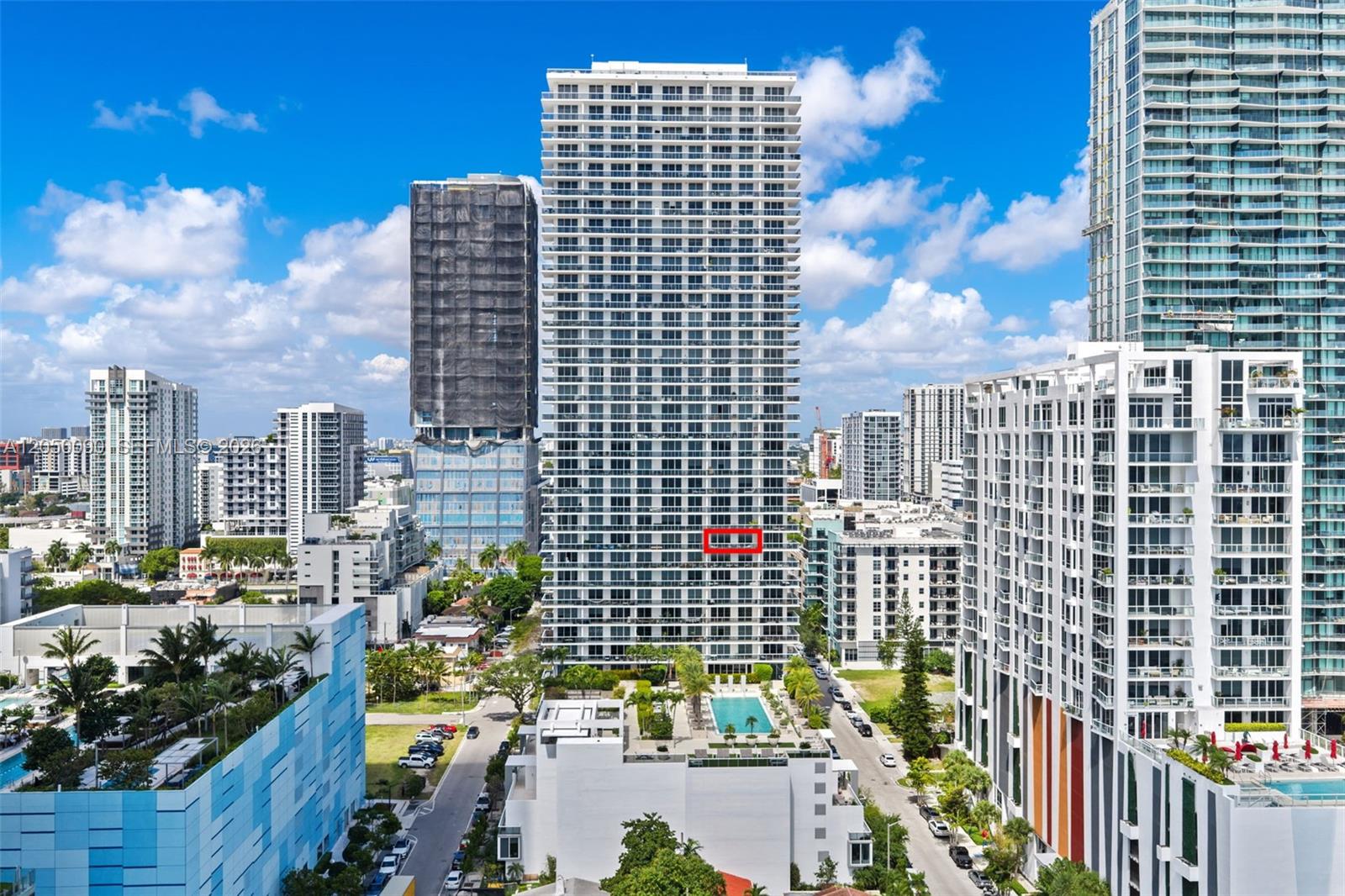 An exterior view of a tall residential skyscraper with a red box highlighting a balcony — 600 NE 27th St # 1402, Miami FL 33137, MIAMI, FL