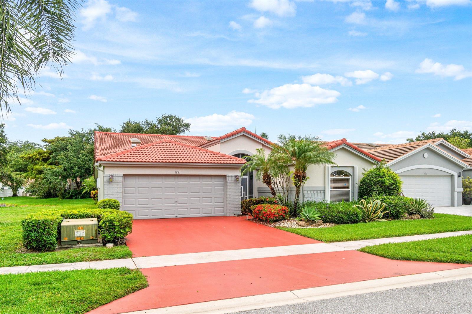 A single-story house with a red tile roof and a red driveway — 7851 Sailing Shores Terrace, Boynton Beach FL 33437, BOYNTON BEACH, FL