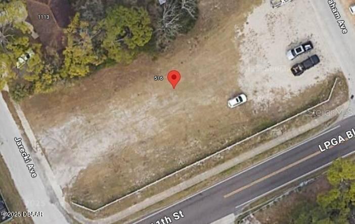 This is an aerial map view of a vacant, rectangular lot located at a street corner — 510 LPGA BOULEVARD, DAYTONA BEACH, FL
