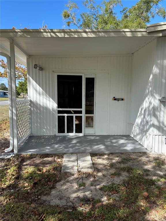 This is a floor plan of a house featuring two bedrooms, two bathrooms, and a garage — 9863 SCEPTER AVENUE, BROOKSVILLE, FL