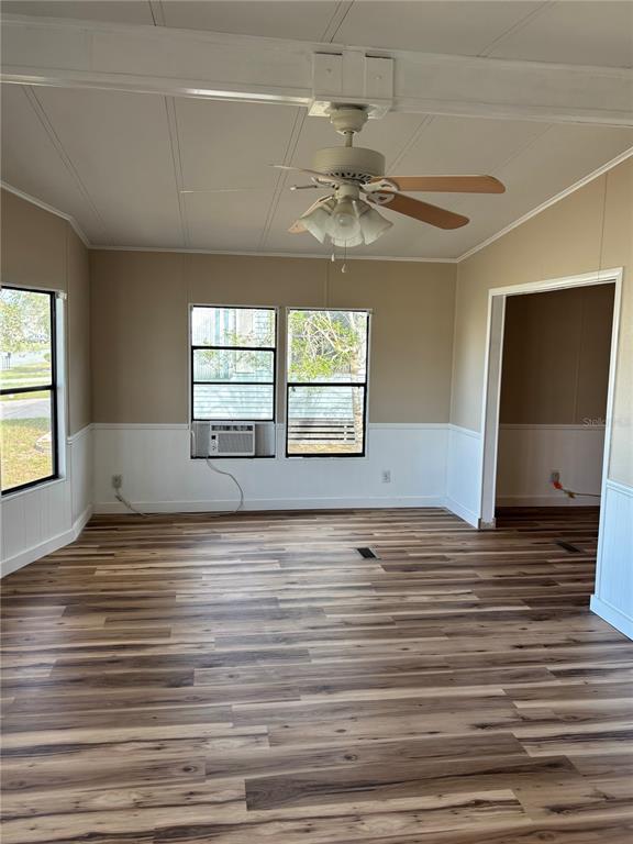 A covered patio features tiled flooring, a ceiling fan, a screen enclosure, and brick steps — 9863 SCEPTER AVENUE, BROOKSVILLE, FL