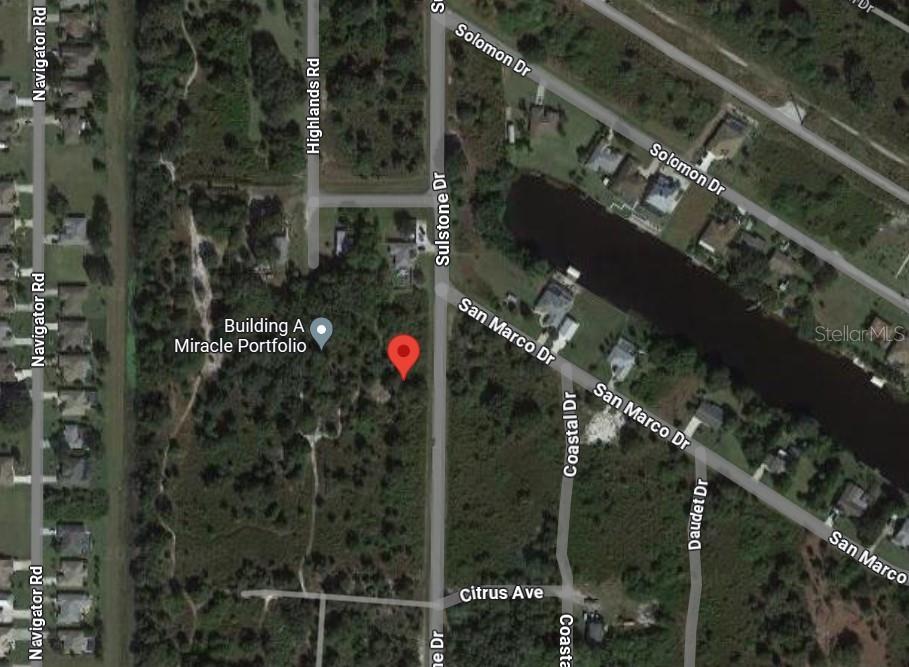 This is a satellite map view showing a vacant lot located between Sulstone Drive and Navigator Road — 1433 SULSTONE DRIVE, PUNTA GORDA, FL