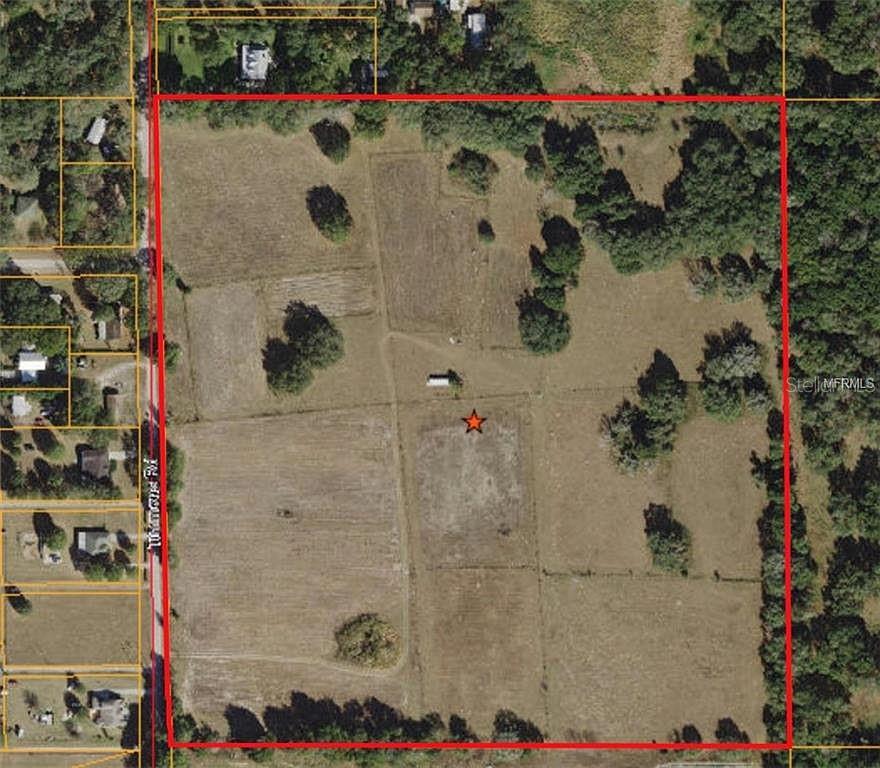 This is an aerial map showing a large, rectangular plot of land with a red border — 10201 TIMMONS ROAD, THONOTOSASSA, FL
