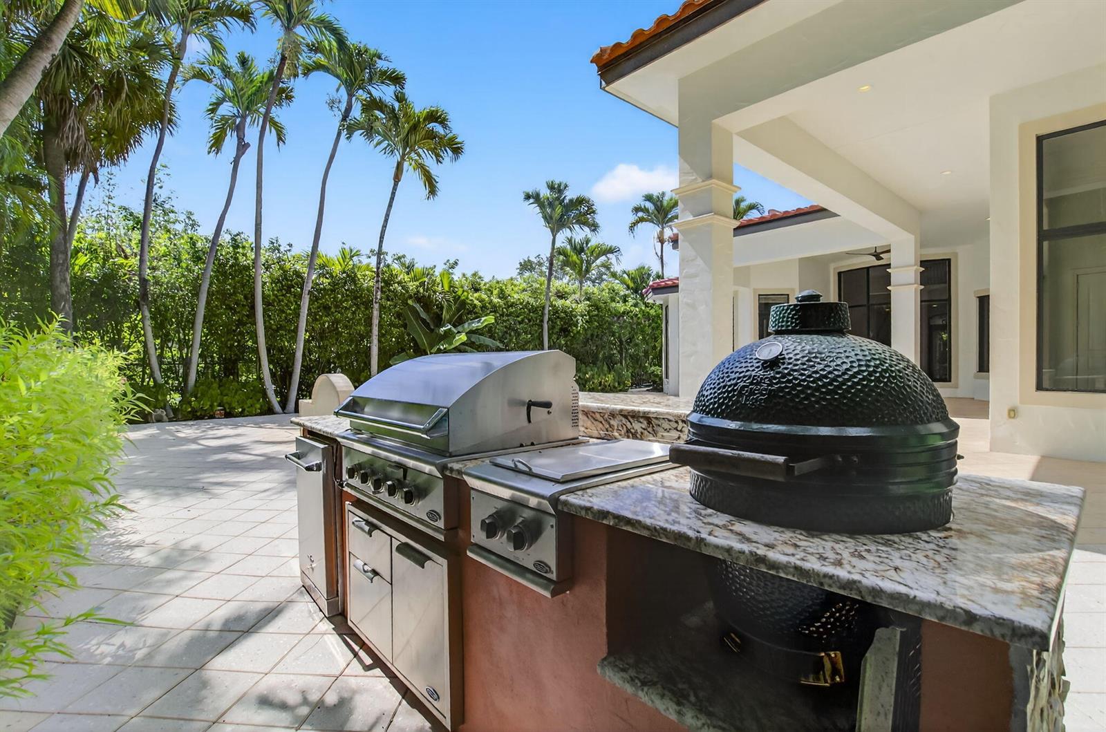 A two-story house with a brick driveway, a garage, and a front yard fountain — 717 NW 4th Street, Boca Raton FL 33486, BOCA RATON, FL