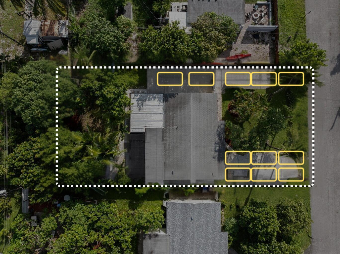 An aerial view shows a residential property with a house, driveway, and surrounding trees — 607 W Perry Street, Lantana FL 33462, LANTANA, FL