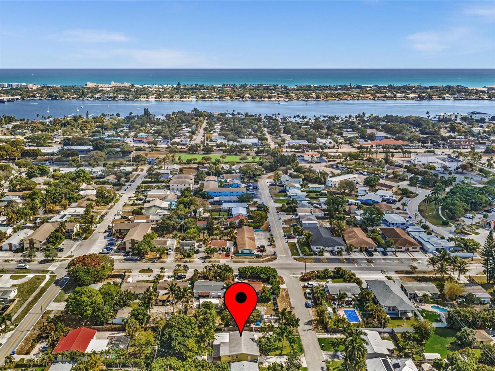 An aerial view shows a residential neighborhood with a red location pin on a house — 607 W Perry Street, Lantana FL 33462, LANTANA, FL