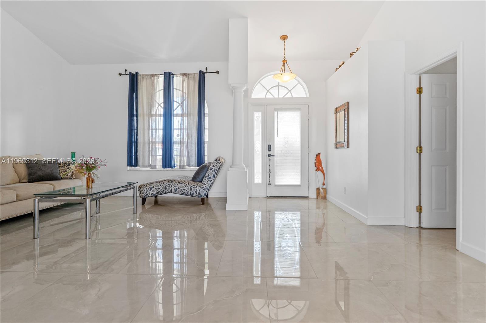 A white single-story house with a dark metal roof and a two-car garage — 2025 NW 7th ter, Cape Coral FL 33993, CAPE CORAL, FL