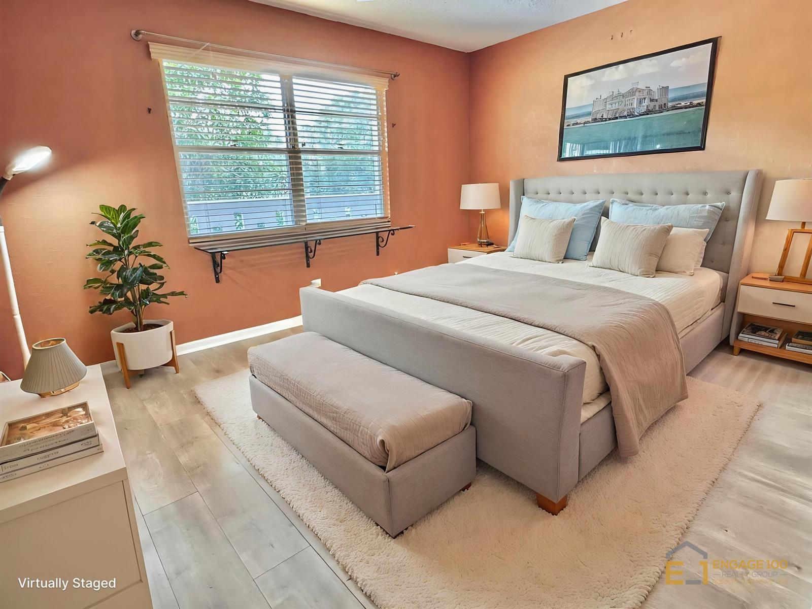 An empty room with wood-look flooring, a mirrored closet, and a sliding door to a balcony — 2003 Granada Drive # J2, Coconut Creek FL 33066, COCONUT CREEK, FL