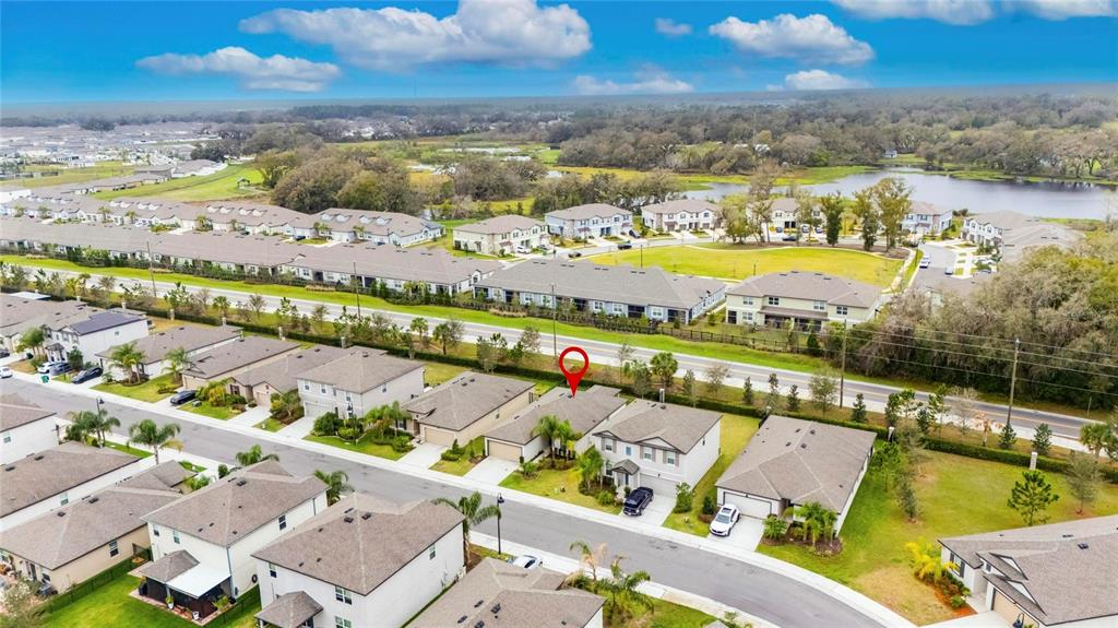 An aerial view shows a suburban neighborhood with a red pin marking a single-family home — 6927 SHELBY LYNN WAY, ZEPHYRHILLS, FL