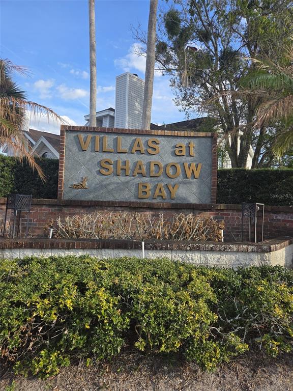 A brick and stone monument sign displays the name Villas at Shadow Bay — 3226 FOX SQUIRREL DRIVE, KISSIMMEE, FL